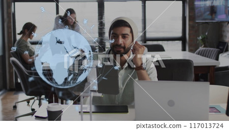 Image of globe and data processing over diverse business people in office Image of globe and data processing over diverse business people in office 117013724