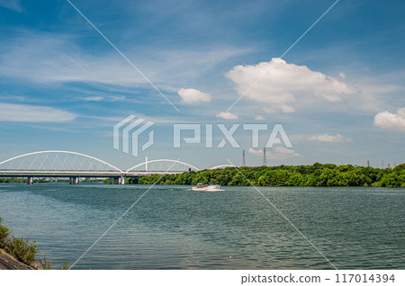 Osaka Monorail railway bridge and summer scenery of Yodo River 117014394