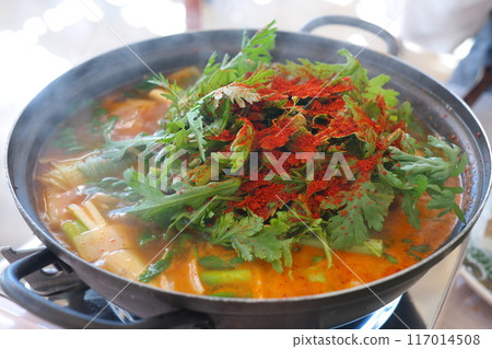 Korean food, spicy soup with fish and vegetables in a pot Korean food, spicy soup with fish and vegetables in a pot 117014508