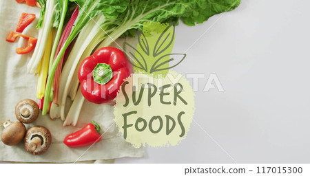 Super foods text image over fresh vegetables including bell pepper and mushrooms Super foods text image over fresh vegetables including bell pepper and mushrooms 117015300