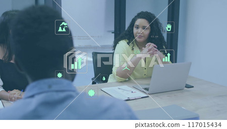 Image of eco icons over diverse business people in office 117015434