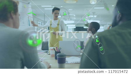 Image of ecology icons over diverse colleagues having meeting in office Image of ecology icons over diverse colleagues having meeting in office 117015472