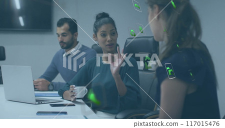 Image of ecology icons over diverse colleagues having meeting in office Image of ecology icons over diverse colleagues having meeting in office 117015476