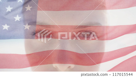 Image of american flag over portrait close up of caucasian woman in sunshine opening eyes 117015544