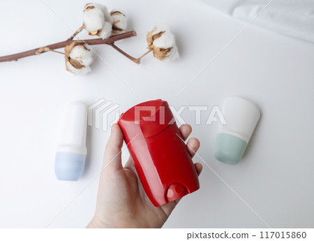 Choice of deodorant or antiperspirant. Looking at the jars on the table. Safe or critical deodorant ingredients Choice of deodorant or antiperspirant. Looking at the jars on the table. Safe or critical deodorant ingredients 117015860