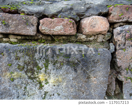 Vintage masonry stone. Old wall made of rough stones. Background of solid material. Vintage masonry stone. Old wall made of rough stones. Background of solid material. 117017213