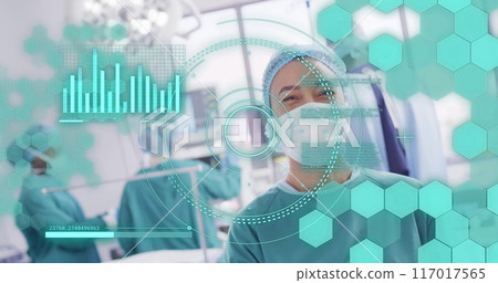 Image of scope scanning and data processing over biracial female surgeon in operating theatre 117017565