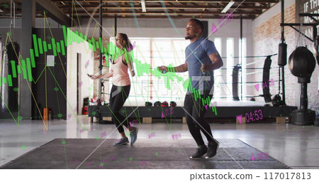 Jumping rope in gym, fitness data analysis image over athletes Jumping rope in gym, fitness data analysis image over athletes 117017813