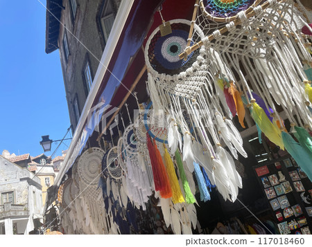 A building hung with white hand-knitted ornaments 117018460