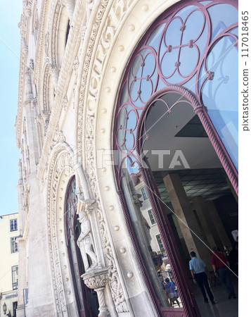 White building with carved patterns and glass doors White building with carved patterns and glass doors 117018465