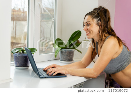 Embracing motherhood and career, a radiant expectant mother works 117019072