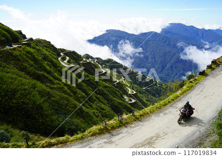 Biker riding in Zig Zag Road of Old Silk Route East Sikkim 117019834