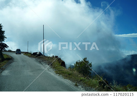 Car Driving through Silk Route Sikkim in Cloudy Weather Car Driving through Silk Route Sikkim in Cloudy Weather 117020115
