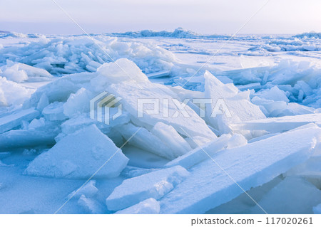 Winter landscape photo with ice hummocks and snow Winter landscape photo with ice hummocks and snow 117020261