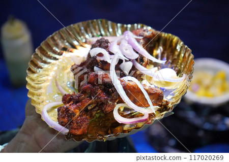 Chicken fry is served with Onion Salad at Zakaria Street During Eid Chicken fry is served with Onion Salad at Zakaria Street During Eid 117020269