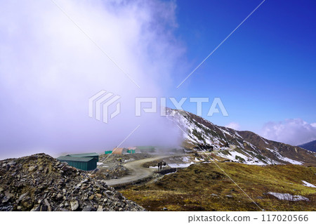 Cloud Stuck in snow capped Himalayan mountain in Sikkim silk route 117020566
