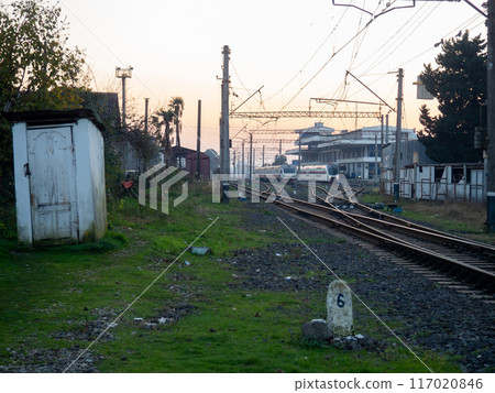 Outdoor wooden toilet at the railway station. Transport node. Trains. Lots of rails. 117020846