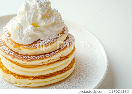 "AI generated image" of stylish pancakes covered in cream 117021183