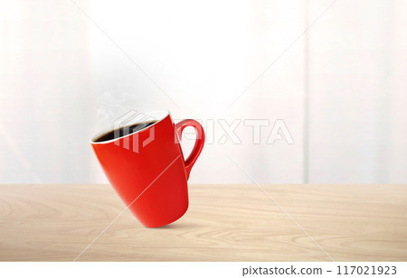 Hot coffee in red mug on wooden table There is a white mirror in the background. Hot coffee in red mug on wooden table There is a white mirror in the background. 117021923