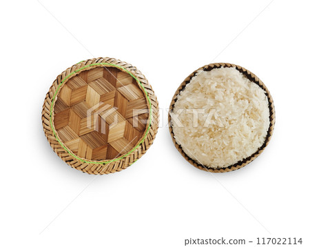 Traditional patterned bamboo box with Thai sticky rice on white background. Traditional patterned bamboo box with Thai sticky rice on white background. 117022114