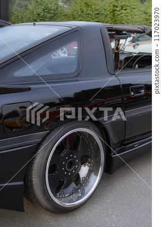 27.07.2024 Novosibirsk, Meet, Targa Toyota Supra a70 1990 in Black, pop-up headlights vertical close up 117023970