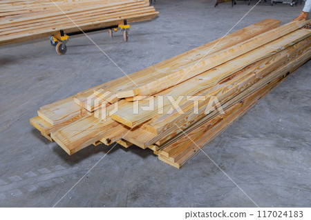 Wooden boards are stacked on construction site are ready to be used 117024183