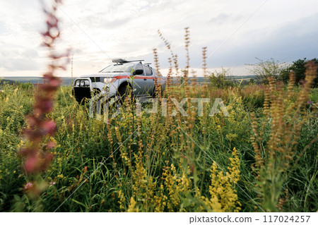 A rescue car stands in the middle of the field in summer 117024257