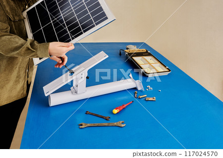 Green energy for street lighting, assembly of an outdoor LED lamp with charging from solar panel. 117024570