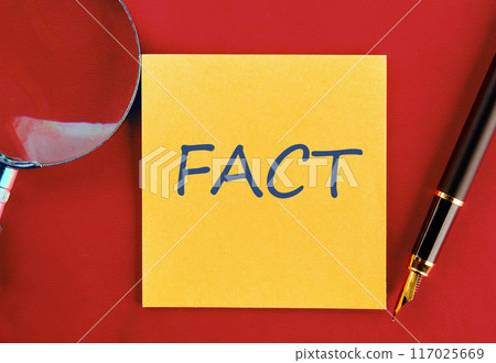 FACT CONCEPT. FACT on a yellow sticker on a red background 117025669