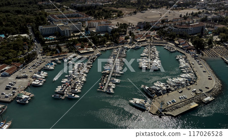 Aerial view of of port and coastal area of Kemer, Turkish beach resort city. Aerial view of of port and coastal area of Kemer, Turkish beach resort city. 117026528