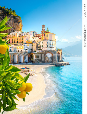Beautiful view of Amalfi on the Mediterranean coast with lemons in the foreground, Italy 117026836