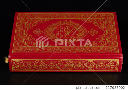 Closed red koran book 117027902