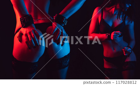 submissive woman bottom slave girl with sexy body and ass with handcuffed for BDSM sex with dominance and submission in underwear 117028812