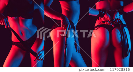 Sexy submissive woman bottom slave girl with whip flogger and handcuffed for BDSM sex with dominance and submission in lingerie 117028816