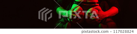 male hands hold a sexy ass of woman girl in panties. Sex between a couple. A wide banner with a black background and a copy space male hands hold a sexy ass of woman girl in panties. Sex between a couple. A wide banner with a black background and a copy space 117028824
