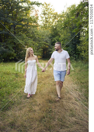 a 30-year-old couple in love in the garden 117030054