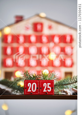 Christmas Advent calendar in the shape of a house with boxes making up the number 2025. Christmas Advent calendar in the shape of a house with boxes making up the number 2025. 117030431