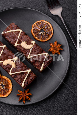 Delicious sweet brownies with chocolate and nuts 117030965