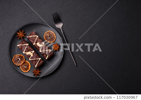 Delicious sweet brownies with chocolate and nuts Delicious sweet brownies with chocolate and nuts 117030967