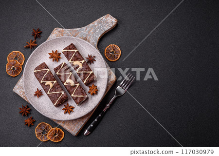 Delicious sweet brownies with chocolate and nuts Delicious sweet brownies with chocolate and nuts 117030979