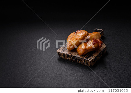 Delicious fried chicken wings with salt, spices and herbs 117031033
