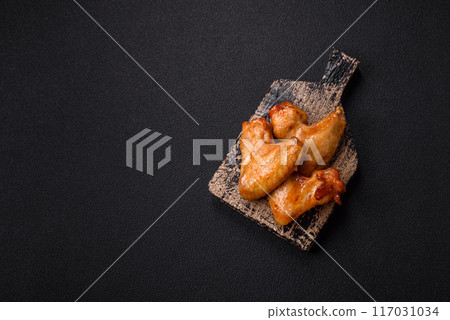 Delicious fried chicken wings with salt, spices and herbs 117031034