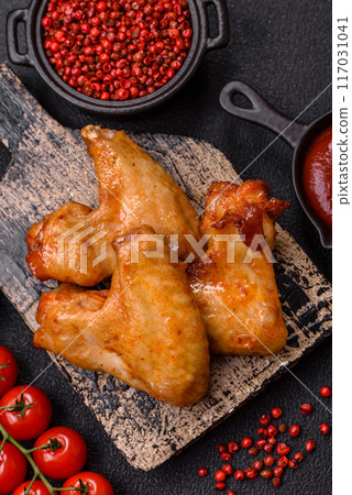 Delicious fried chicken wings with salt, spices and herbs Delicious fried chicken wings with salt, spices and herbs 117031041