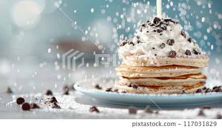 Stacked Pancakes Topped With Chocolate Chips and Whipped Cream on a Light Blue Background 117031829