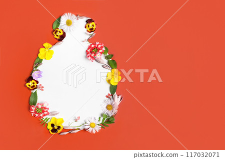 Cut-out bottle of cosmetics made of red paper with frame of flowers and leaves. Design for new product, banner, promotion sale, cosmetic, presentation. Mockup for your text and sentences 117032071