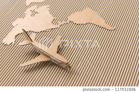 Airplane and world map made of cardboard Airplane and world map made of cardboard 117032886