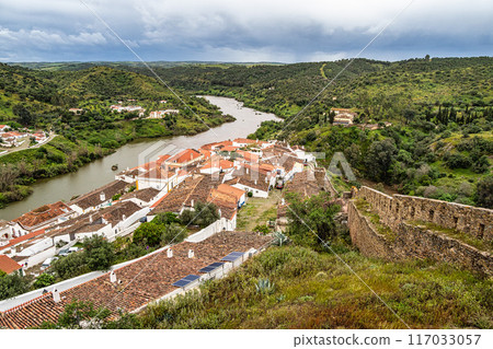 View of the river Guadiana and the village of Mertola. Alentejo Region. Portugal View of the river Guadiana and the village of Mertola. Alentejo Region. Portugal 117033057