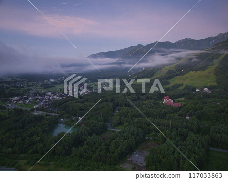 Before sunrise in midsummer, sea of clouds and Happo-one ski resort, Hakuba village, Nagano prefecture (aerial photography by drone) Before sunrise in midsummer, sea of clouds and Happo-one ski resort, Hakuba village, Nagano prefecture (aerial photography by drone) 117033863