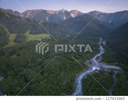 Before sunrise in midsummer, the beautiful Hakuba Sanzan mountains, Hakuba Village, Nagano Prefecture (aerial photography by drone) Before sunrise in midsummer, the beautiful Hakuba Sanzan mountains, Hakuba Village, Nagano Prefecture (aerial photography by drone) 117033865