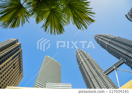A beautiful view of the Petronas Twin Towers in Kuala Lumpur against the blue sky 117034191